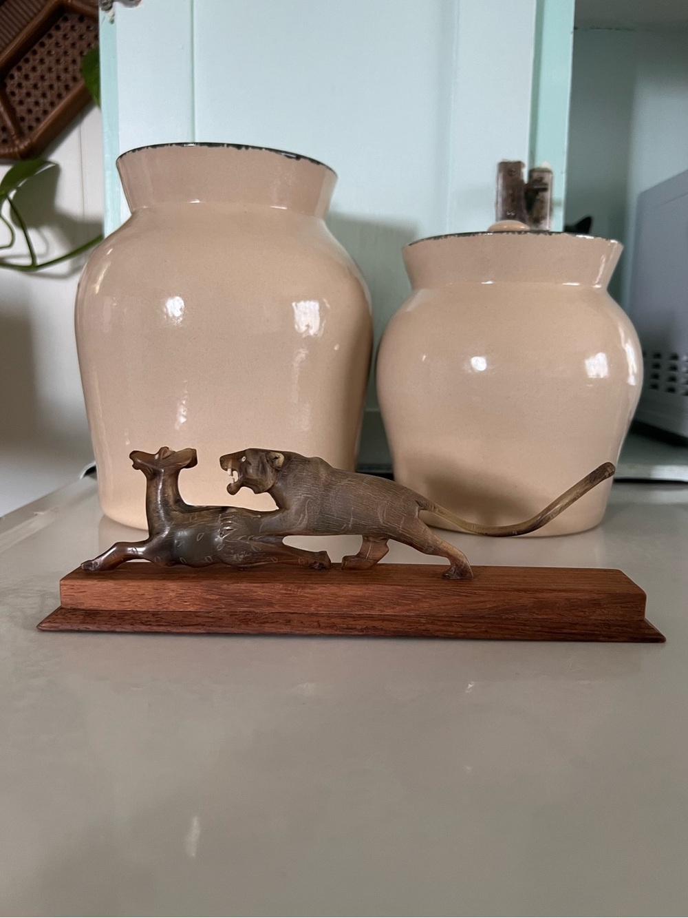 Water Buffalo Horn hand-carved into a panther pouncing on an antelope